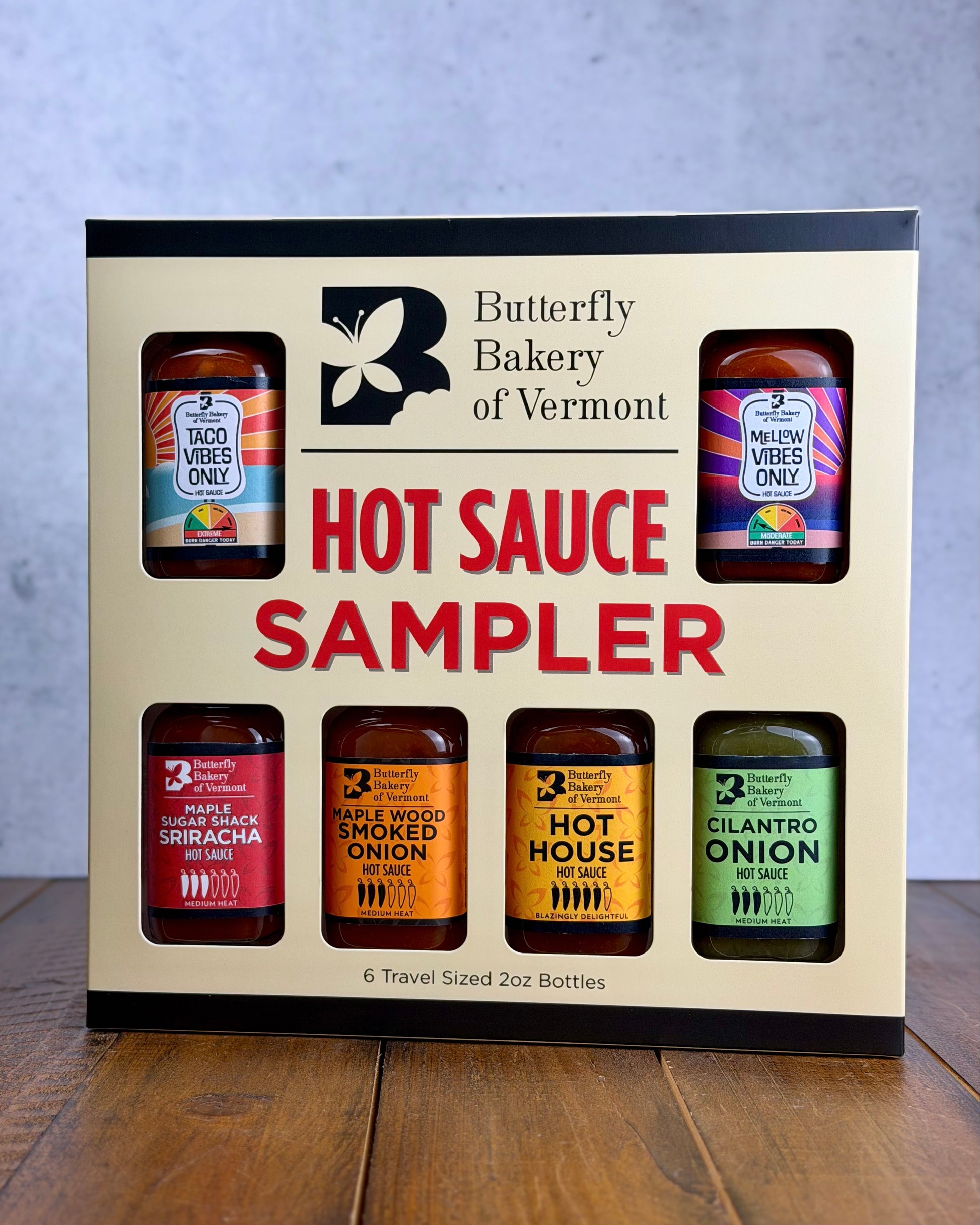 Hot sauce sampler box from Butterfly Bakery of Vermont on a wooden surface