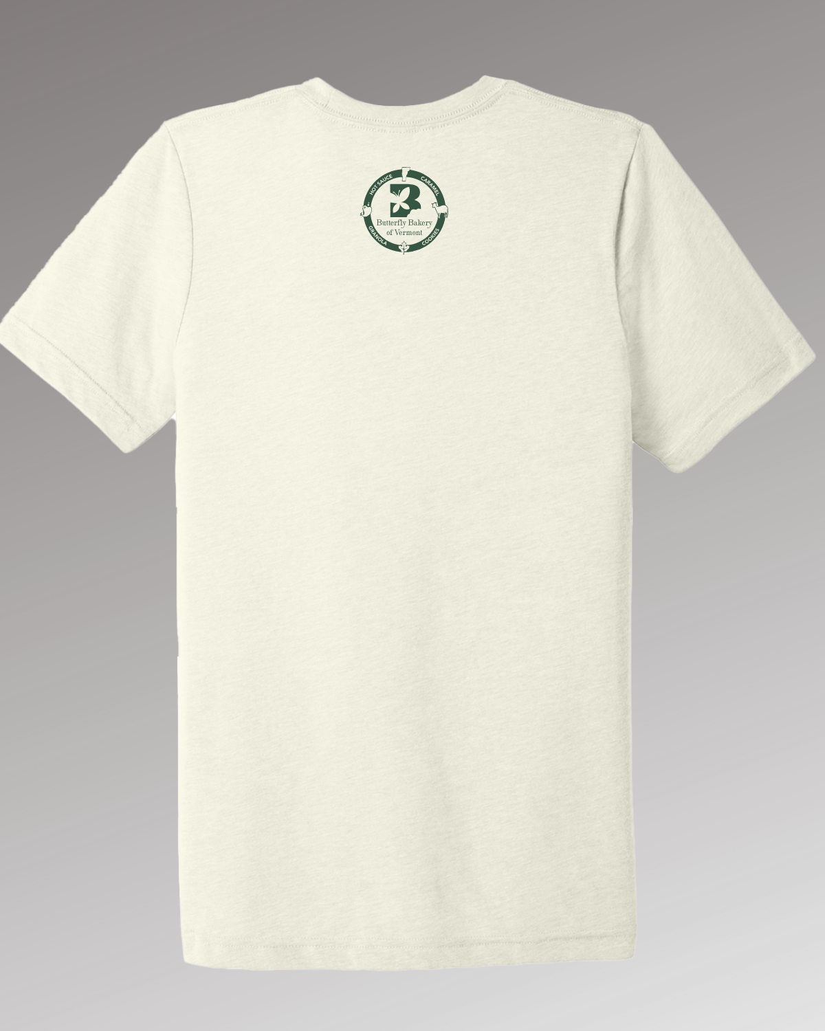 Back view of a cream colored t-shirt with the Butterfly Bakery of Vermont logo appearing just below the collar