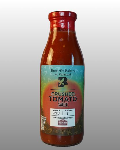 Bottle of Butterfly Bakery of Vermont crushed tomato sauce with a gray background
