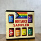 Butterfly Bakery of Vermont's 'Pride Pack' hot sauce sampler box on a wooden table