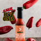 Bottle of Butterfly Bakery of Vermont's Smoked Serrano Squash Reaper X hot sauce surrounded by red hot peppers on a wooden surface with the 'As Seen On Hot Ones' logo.