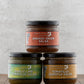 Butterfly Bakery of Vermont full line of Salsa on a wood surface 