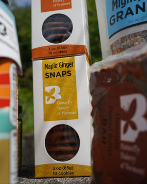 Butterfly Bakery of Vermont Maple Ginger Snaps packaging with a blurred background
